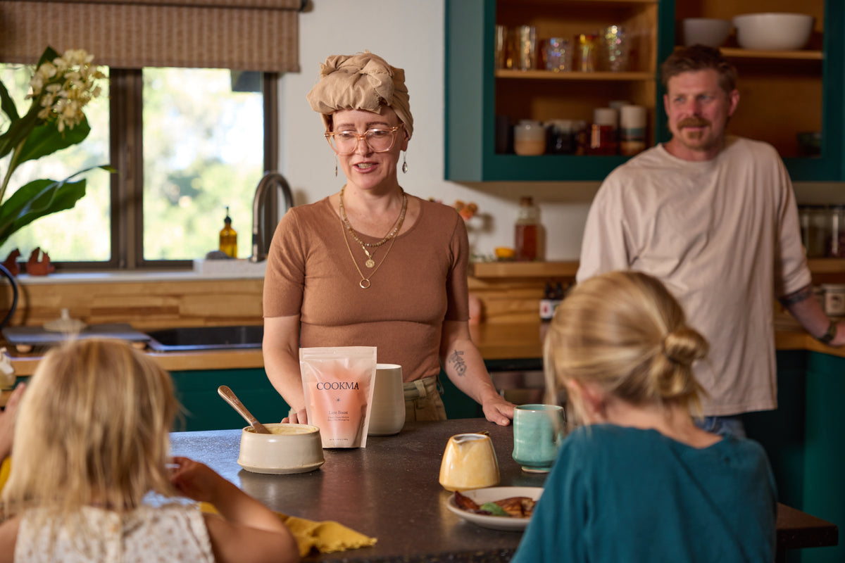 A family gathered at the kitchen counter for breakfast